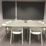 A shared conference room is often one of the amenities offered in coworking space. 